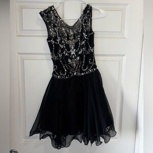 Short black, sparkly prom dress.